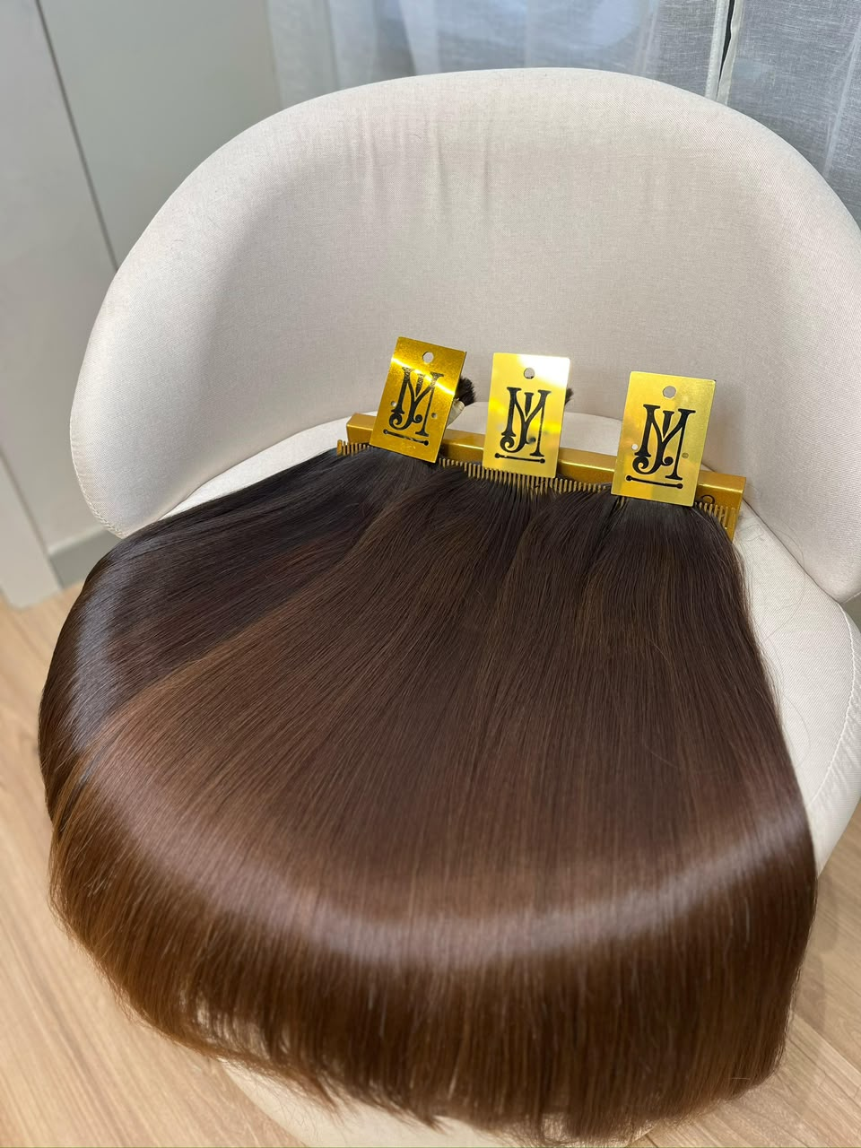 Telas de mega hair da marca JM em fio castanho brilhoso
